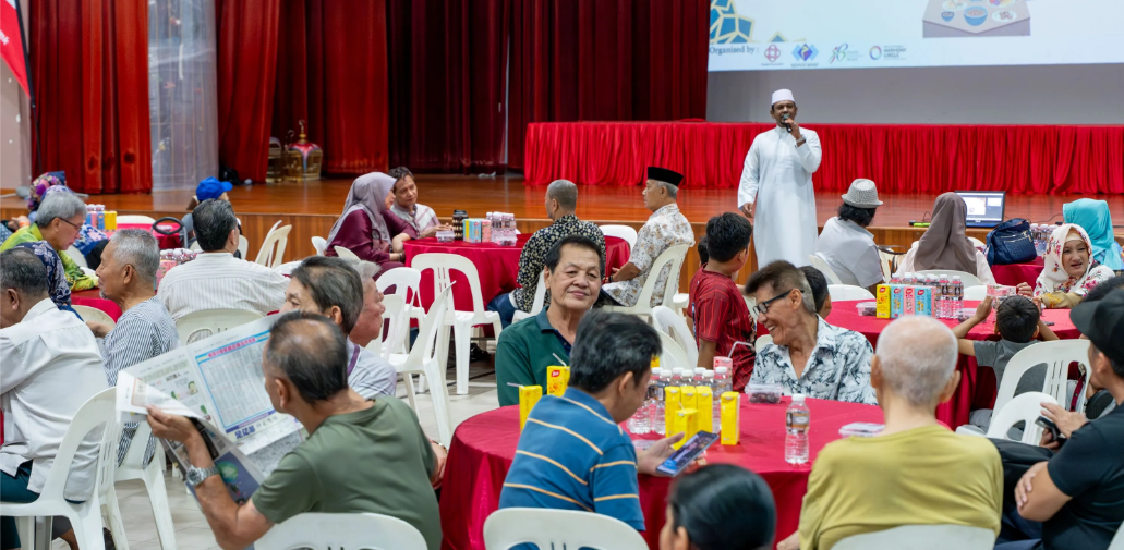 Residents received Hari Raya goodies and sponsored groceries during the community gathering.